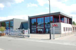 Modern office building of IAI Industrial Systems with secure perimeter and glass facade.